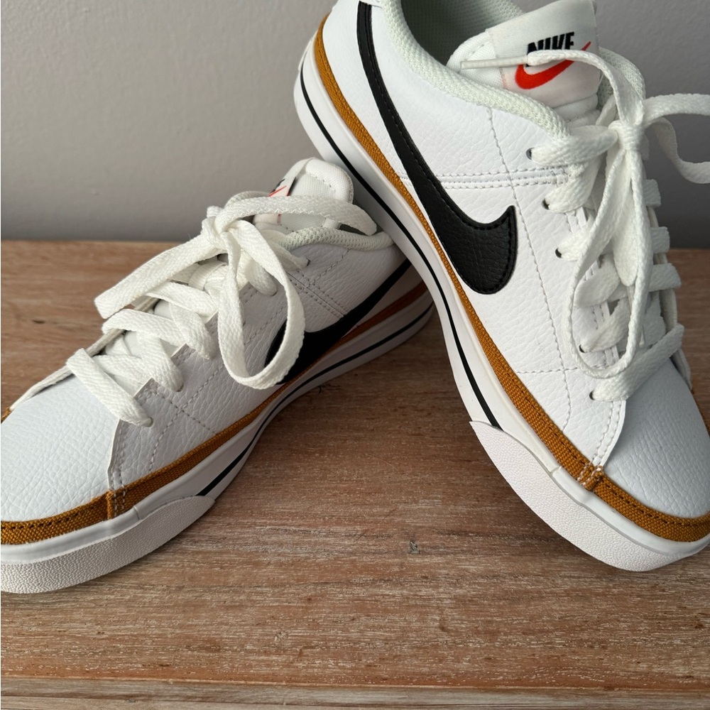 Nike White and Black Sneakers with Gold Accents